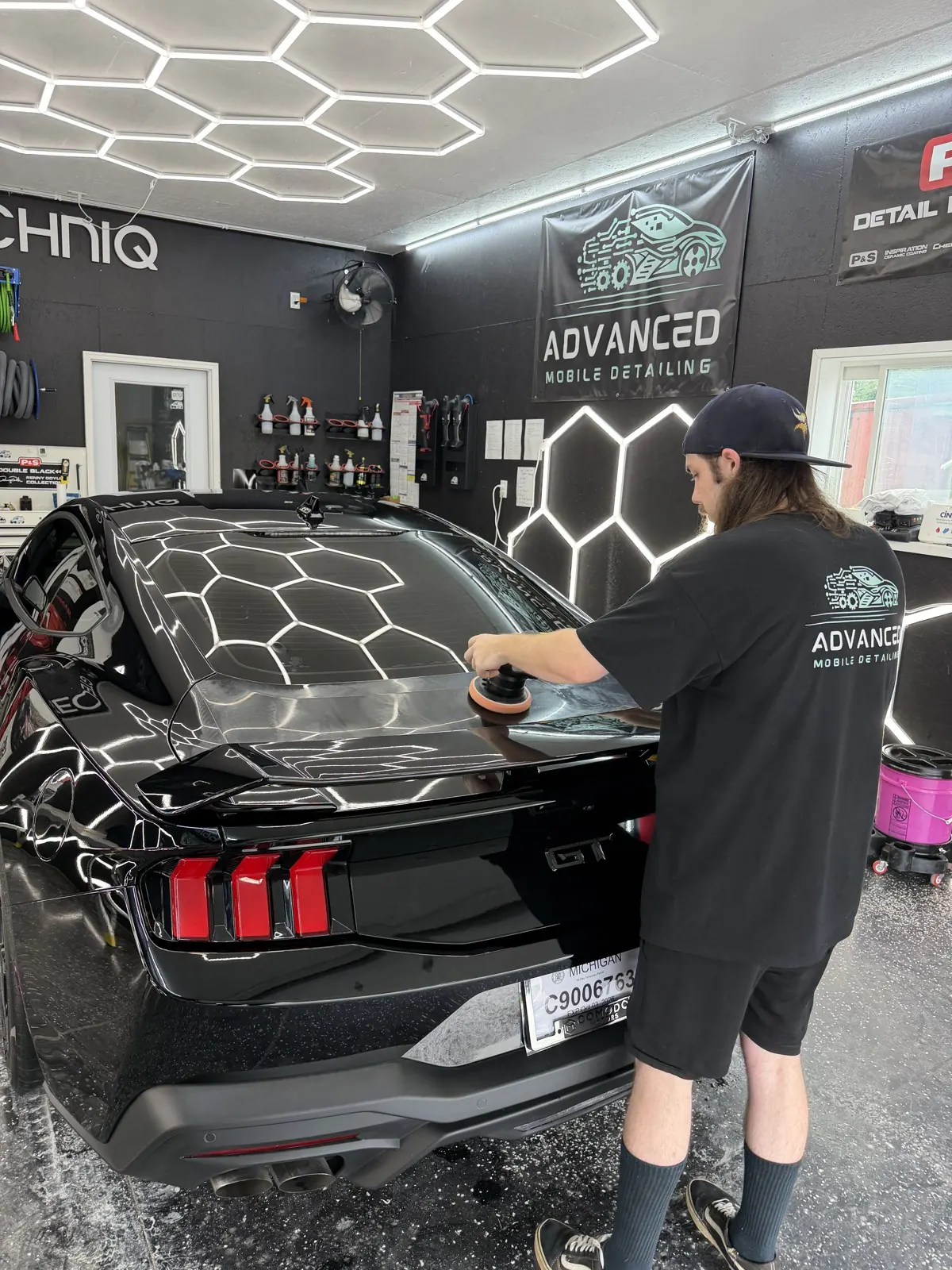 AMD installer working on a Mustang in the coating bay, Louisville