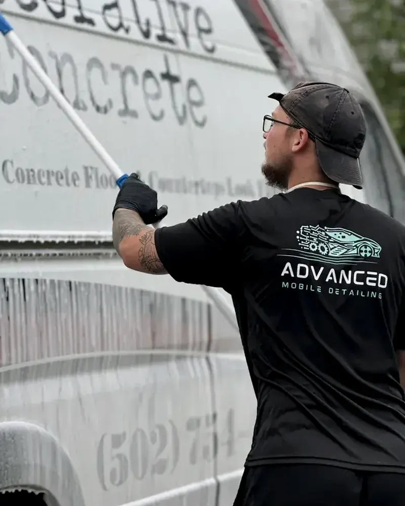 AMD tech washing a fleet vehicle on site in Louisville