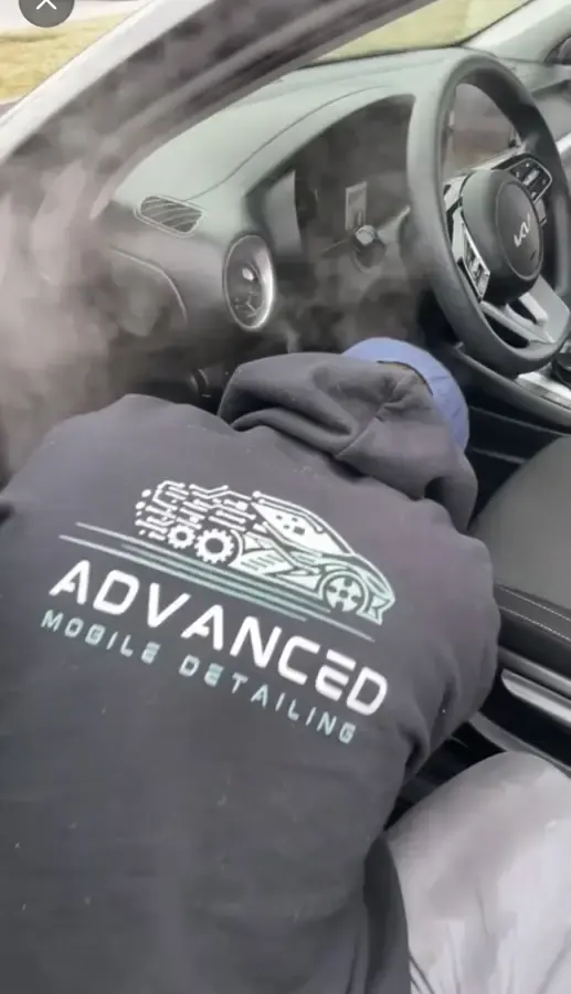 AMD technician detailing a car interior during a mobile detail in Louisville