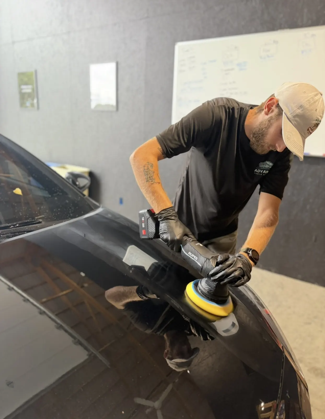 AMD tech machine polishing paint during paint correction in Louisville, KY