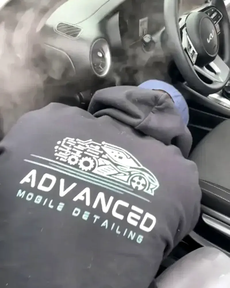 AMD tech steam treating a vehicle interior for odor in Louisville, KY